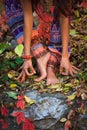 Barefoot woman legs and hands in yoga and mudra gesture in colo Royalty Free Stock Photo