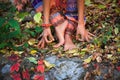 Barefoot woman legs and hands in yoga and mudra gesture in colo Royalty Free Stock Photo