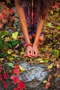 Barefoot woman legs and hands in yoga stretch pose in colorful