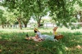 Barefoot woman lying near laptop, food