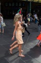 Barefoot woman returning from Melbourne Cup Royalty Free Stock Photo