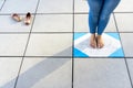 Bare feet on cement floor, moment yoga