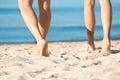 Barefoot young couple on sea beach Royalty Free Stock Photo