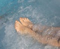 Feet of young woman during a hydromassage session in the luxurio Royalty Free Stock Photo