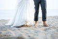 Barefooted bride and groom on the beach Royalty Free Stock Photo