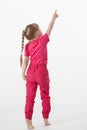 Barefooted little girl turning back and indicating something up Royalty Free Stock Photo