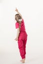 Barefooted little girl turning back and indicating something up Royalty Free Stock Photo