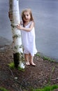 Barefooted Toddler by Tree