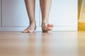 Barefoot asian woman clean and solf skin on the wooden floor Royalty Free Stock Photo