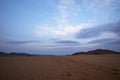 Barren red sand and dead grass in the desert Royalty Free Stock Photo