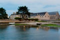 Historic stone houses in typical architectural style of Normandy and harbor in Barfleur Royalty Free Stock Photo