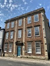 Barford House. 18th century three-storey house on the corner of St John\'s Street and Castle Road, grade II listed.
