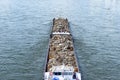 A barge carrying scrap metal on the Rhine in western Germany. Royalty Free Stock Photo