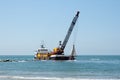 Barge dredging a harbor Royalty Free Stock Photo