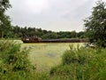 A barge floating on the river in summer