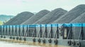 Barge full of black coal cruising on Mahakam River, Borneo, Indonesia. Royalty Free Stock Photo