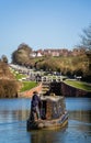 Barge going up Caen flight of locks in Devizes, Wiltshire, UK Royalty Free Stock Photo