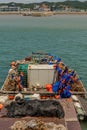 Barge loaded with industrial fishing supplies in water