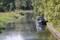 A barge moored to the bank on the Grand Union Canal at Lapworth in Warwickshire, England Royalty Free Stock Photo