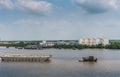 Barge pulled by boat on Long Tau River, Nhon Trach, Vietnam