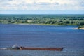 Barge on river sailing to port for cargo. Transport for transportation of crushed stone and sand Royalty Free Stock Photo