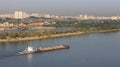 Barge with sand is on the Irtysh River.