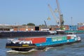 Barge ship transporting containers in the Port of Antwerp