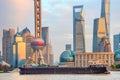 Barge by sunset Shanghai skyline