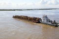 The barge transports timber along the river. Royalty Free Stock Photo