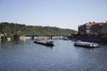 Barge and Tugboat cargo ship and River Cruises sailing in Vltava river near Charles Bridge Royalty Free Stock Photo