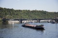 Barge and Tugboat cargo ship and River Cruises sailing in Vltava river near Charles Bridge Royalty Free Stock Photo