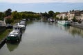 Barges moored on the bank of the Canal du Midi in Castelnaudary Royalty Free Stock Photo