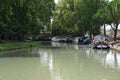 Barges moored on the bank of the Canal du Midi in Castelnaudary Royalty Free Stock Photo