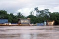 Barges moored on the side of the Napo River