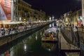 Barges on Naviglio Grande embankment at night life time , Milan,