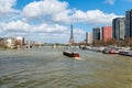 Barges on Seine river with Eiffel Tower in the background - Paris Royalty Free Stock Photo