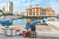 Local fishermen washing, cleaning and selling fresh raw sea fruits Royalty Free Stock Photo