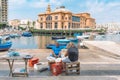 Local fishermen washing, cleaning and selling fresh raw sea fruits Royalty Free Stock Photo