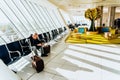 Bari, Italy - March 13, 2019: Business passengers waiting at the door of the terminal of an airport