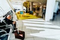 Bari, Italy - March 13, 2019: Business passengers waiting at the door of the terminal of an airport