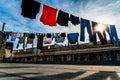 Bari, Italy - March 10, 2019: Clothes hanging from a rope drying in the sun on the roof of an old building