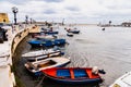 Bari, Italy - March 12, 2019: Old fishing boats moored to port dirty and in disuse Royalty Free Stock Photo