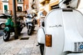 Bari, Italy - March 12, 2019: Old Vespa vintage motorcycles in use, parked on the streets of an old Italian city Royalty Free Stock Photo