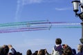 public crowded on the seafront assists to the evolutions of the aerobatic team of the frecce tricolori