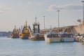 Anchored fishing boats and tugboats in port of Bari Italy