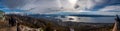 BARILOCHE, ARGENTINA, JUNE 19, 2019: Panoramic view of landscape and paragliding over Nahuel Huapi lake and mountains, with snowed Royalty Free Stock Photo