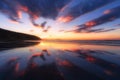 Barinatxe beach with cloud reflections at sunset Royalty Free Stock Photo