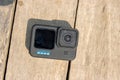 Barisal, Bangladesh - March 12, 2023, Modern action camera on a wooden surface. Professional action camera close up shot on a