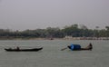 Barisal, Bangladesh, March 12, 2023, Rural fishermen on small wooden boats. Fishermen catching fish on small dinghies floating on