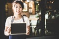 Barista asian women holding label Coffee order in the coffee shop. Royalty Free Stock Photo